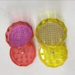 Lightweight 45mm plastic grinder, 2-part design, available in assorted colors for efficient herb grinding.